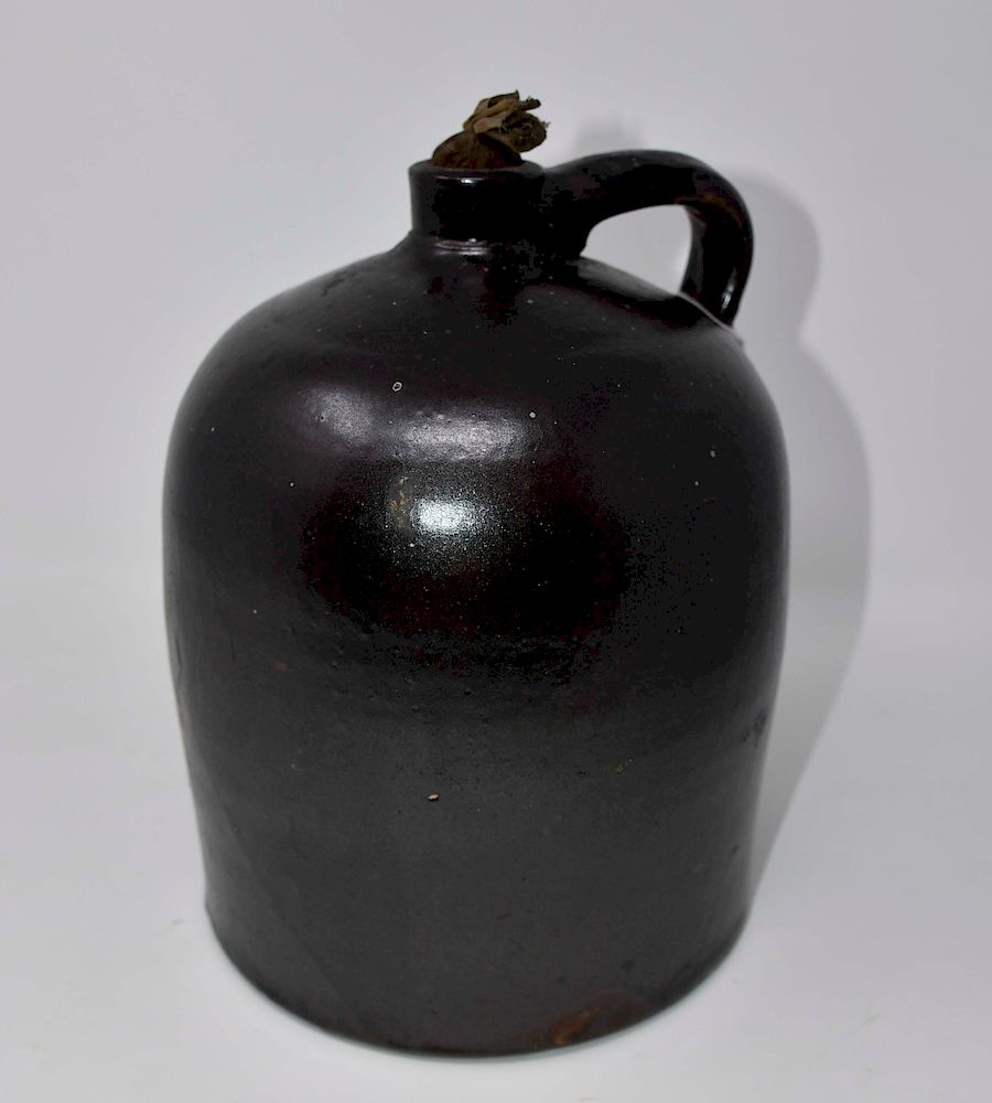 Appraisal: Antique Brown Stoneware Jug Brown Stoneware Jug Measures tall Packaging