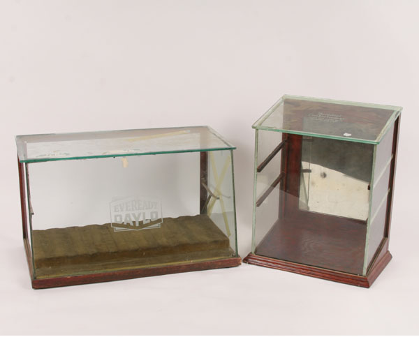 Appraisal: Wood and glass advertising display cases Bonderr's Confectionery and Eveready