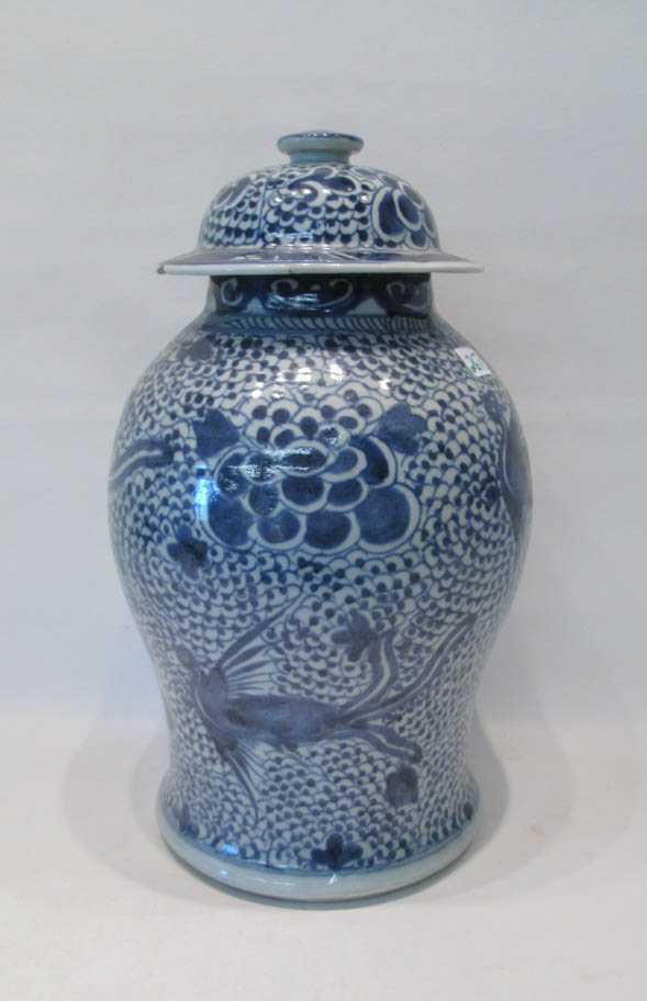 Appraisal: CHINESE BLUE AND WHITE PORCELAIN LIDDED JAR depicting flying phoenix