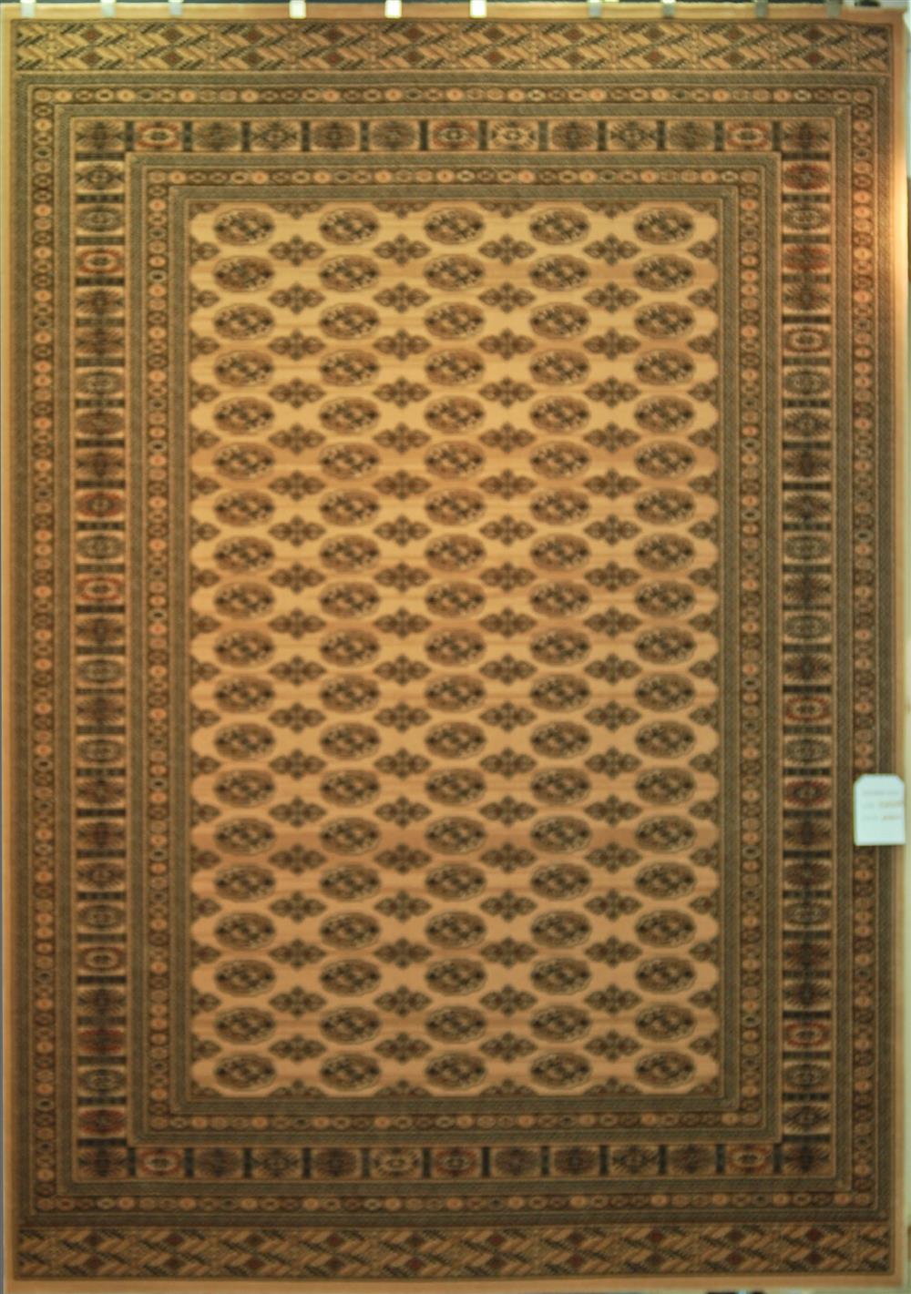 Appraisal: BOKHARA DESIGN MACHINE MADE WOOL ORIENTAL RUG having ivory field