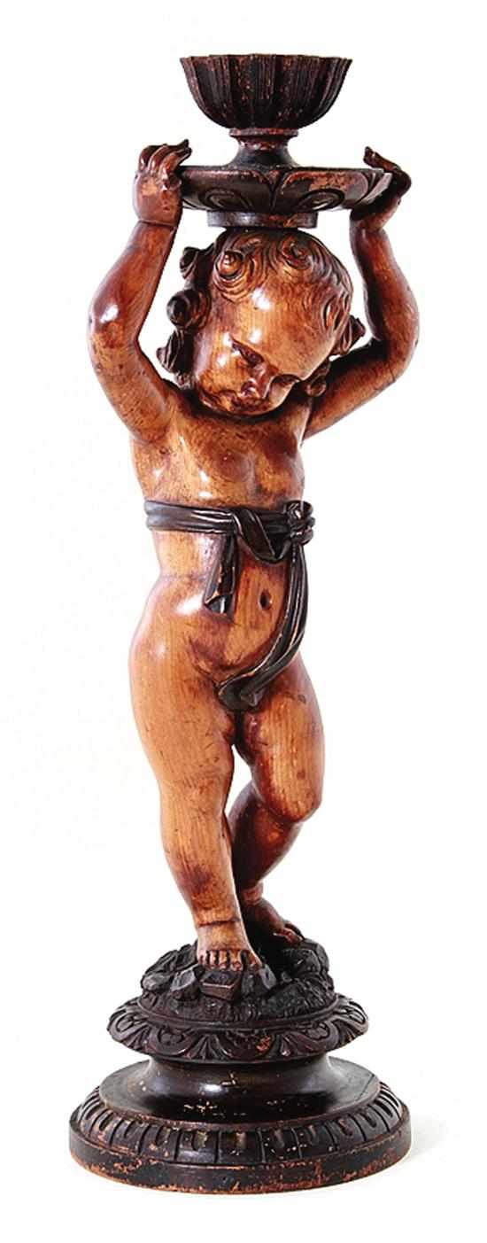 Appraisal: Italian Baroque style carved figure th century standing putti above