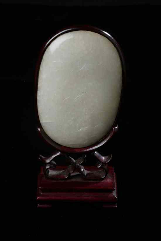 Appraisal: CHINESE WHITE JADE OVAL PLAQUE Qing Dynasty Carved in low