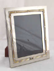 Appraisal: A Gucci silver plated strut backed hardwood photo frame x