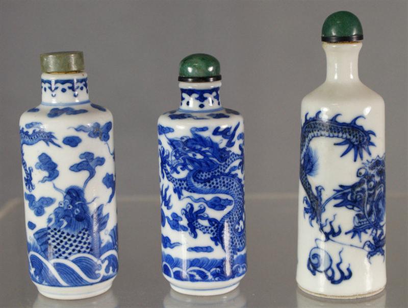 Appraisal: Cylindrical porcelain snuff bottles each with blue underglaze dragon seeking