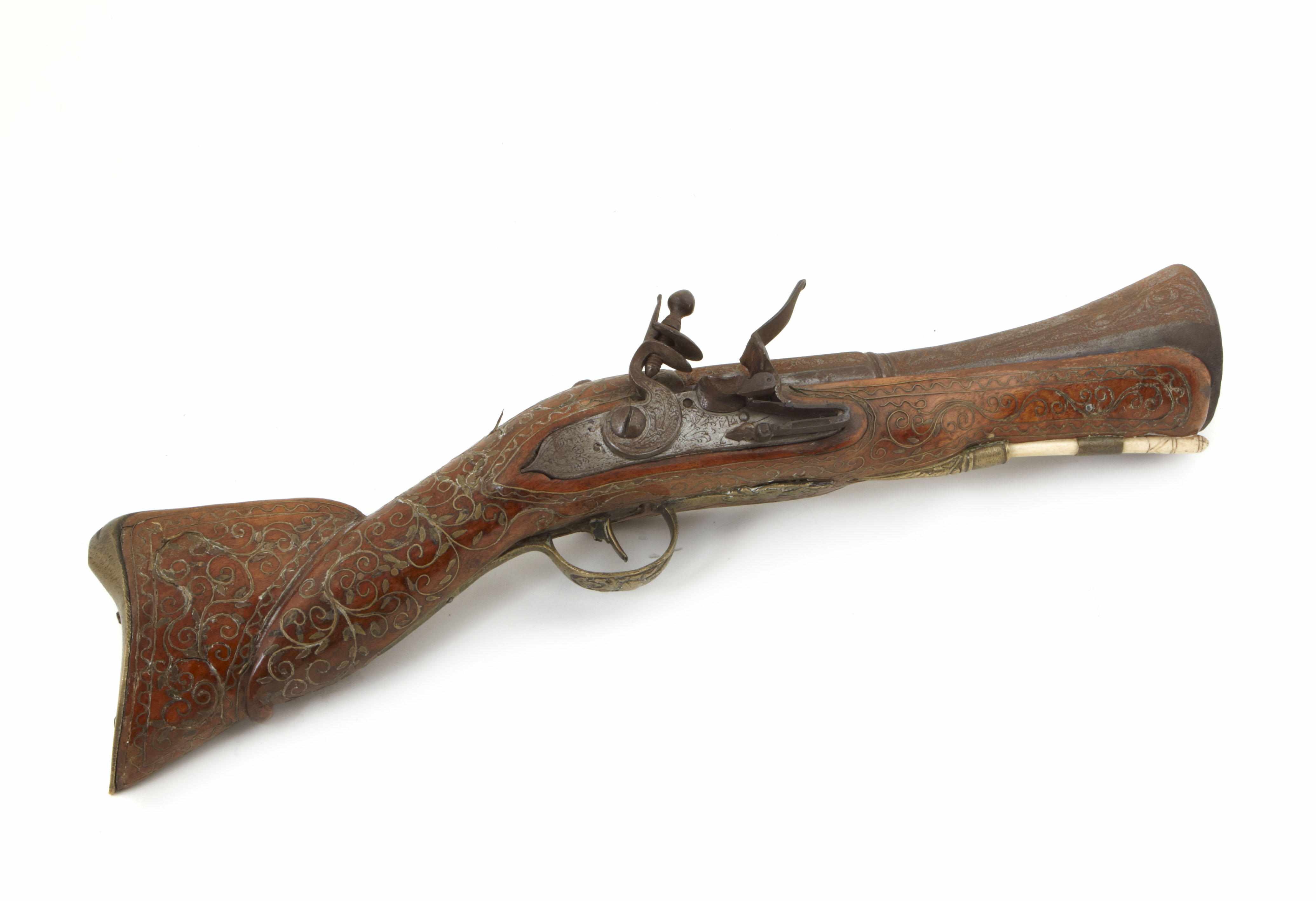 Appraisal: A near Eastern silver inlaid wood and bone pistol length