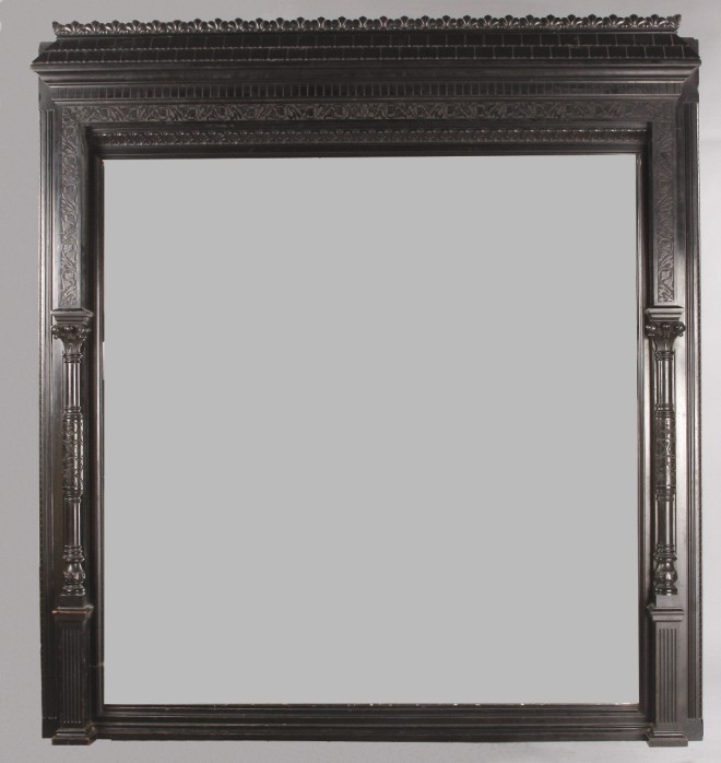 Appraisal: Victorian ebonized walnut column front mirror stylized shingled roof relief