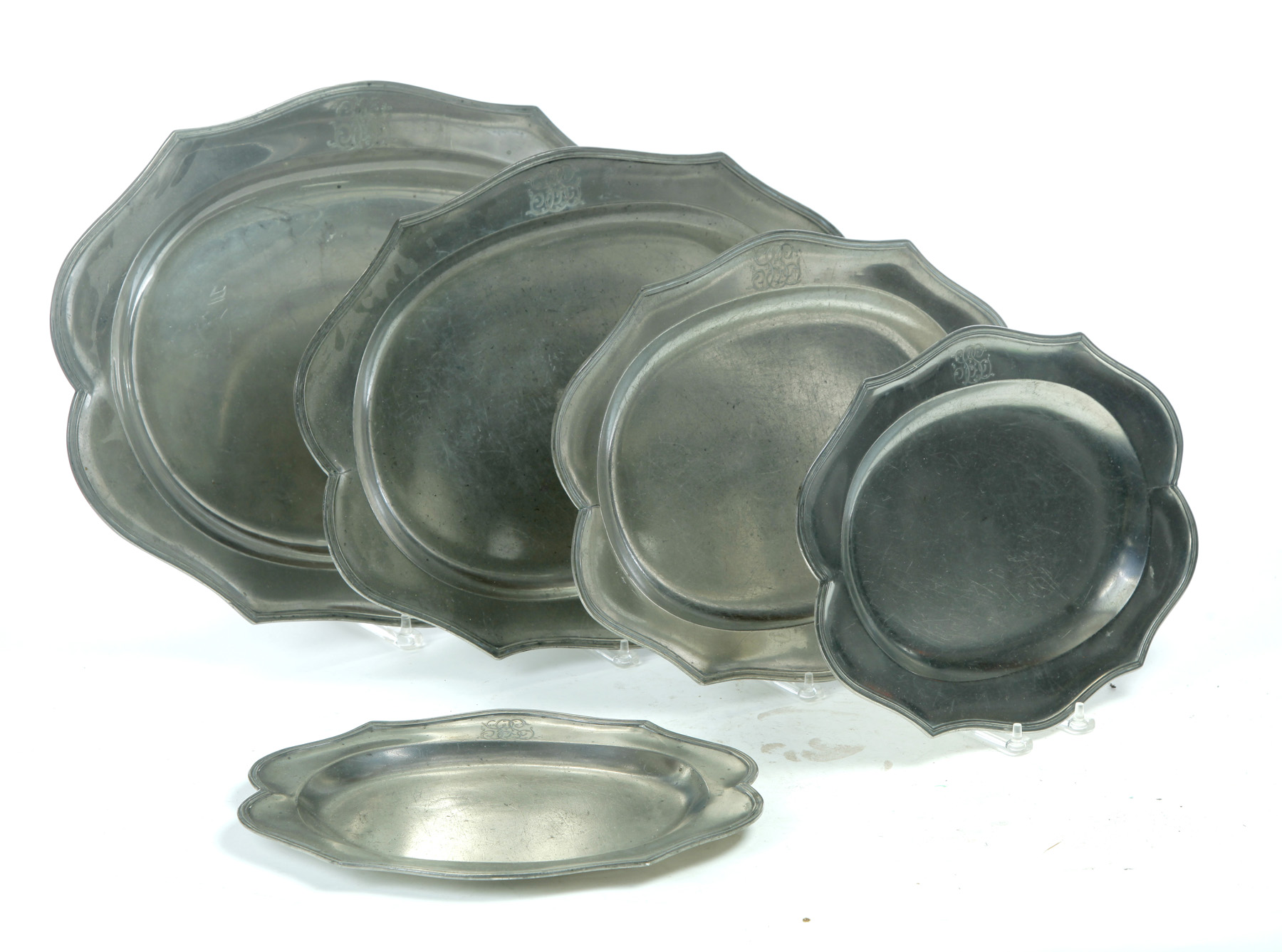 Appraisal: FIVE GRADUATED ENGLISH PEWTER PLATTERS Late th century Scalloped edge