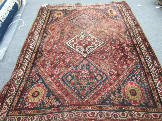 Appraisal: A Ghasghai rug Persian the madder field with an ivory