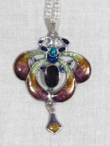 Appraisal: An Art Nouveau enamel silver pendant set with a central