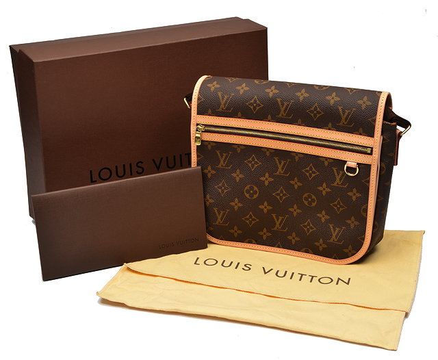 Appraisal: A LOUIS VUITTON MONOGRAMMED CANVAS HANDBAG with fold over flap