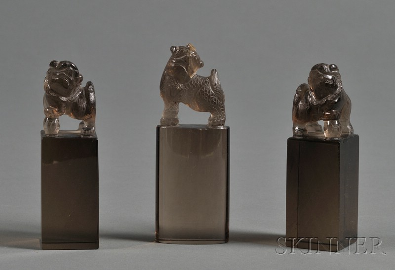 Appraisal: Three Smoky Quartz Seals China th century transparent stone foo