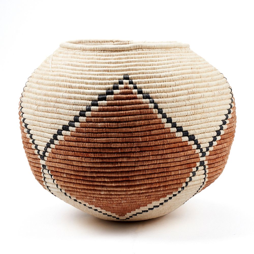 Appraisal: Native American Woven Basket Native American large coil basket decorated