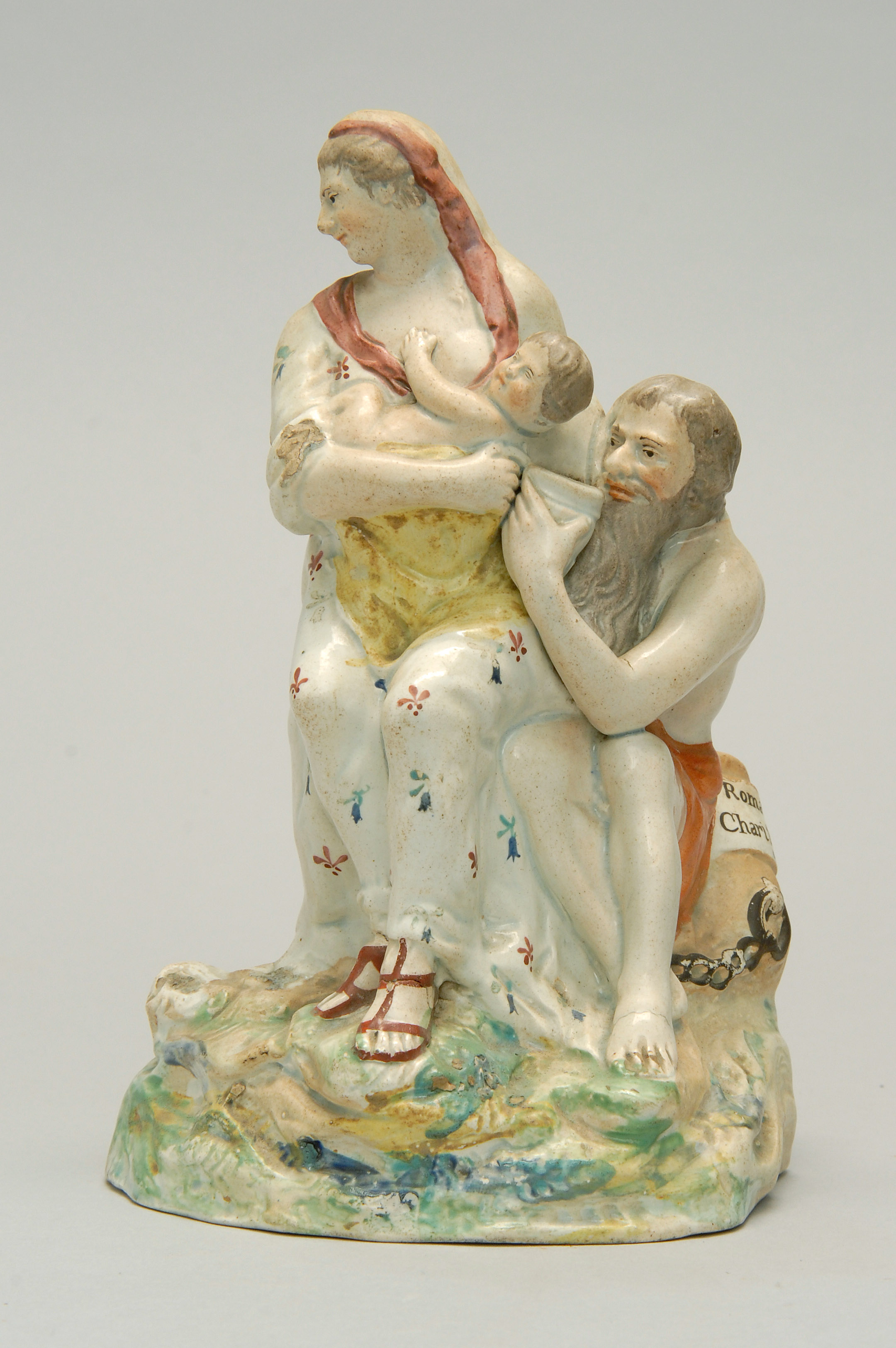 Appraisal: EARLY TH CENTURY STAFFORDSHIRE POTTERY FIGURE GROUP depicting Roman Charity