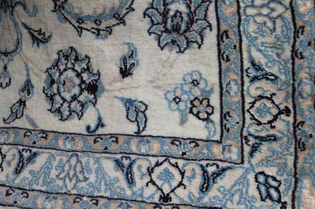 Appraisal: A CREAM GROUND RUNNER with foliate decoration