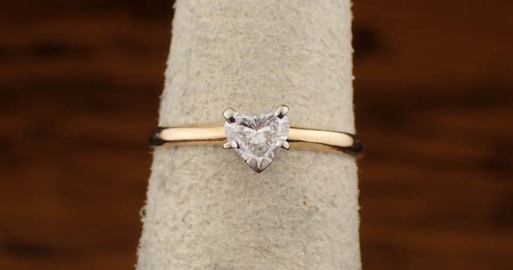 Appraisal: HEART-CUT DIAMOND SOLITAIRE RING K yellow gold ct ring size