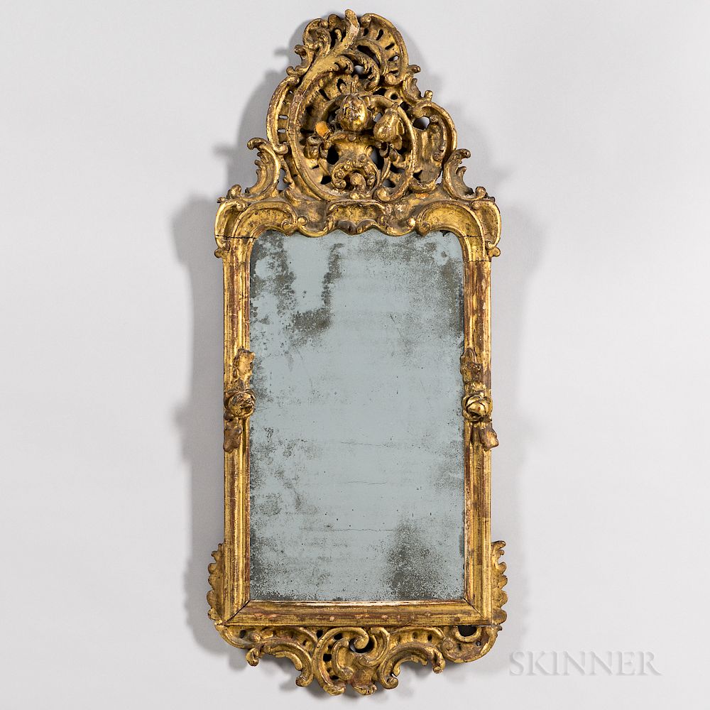 Appraisal: Carved and Gilded Rococo Mirror Carved and Gilded Rococo Mirror