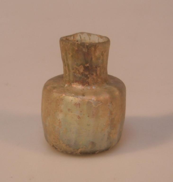 Appraisal: A small post-Roman vertically ribbed bottle made in pale greenish-yellow