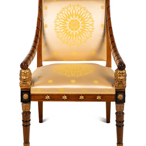 Appraisal: An Empire Style Parcel Gilt and Ebonized Armchair th Century