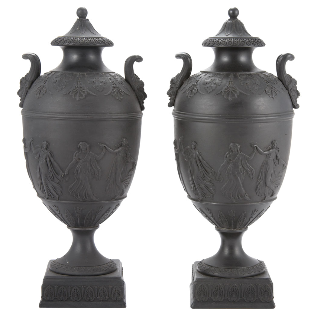 Appraisal: Pair of Wedgwood Basalt Urns Each with loop handles molded