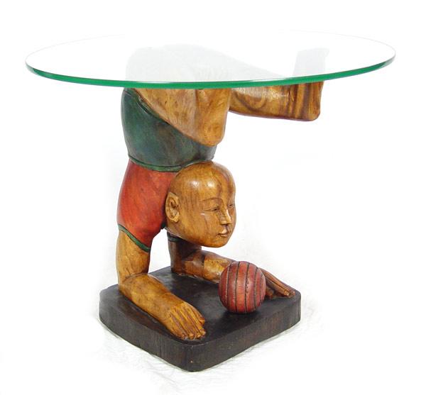 Appraisal: WHIMSICAL CHINESE CARVED FIGURAL GLASS TOP TABLE Upside down boy