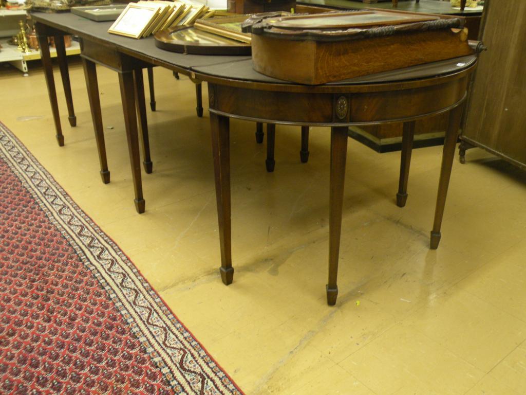 Appraisal: A mahogany extending dining table in George III style comprising