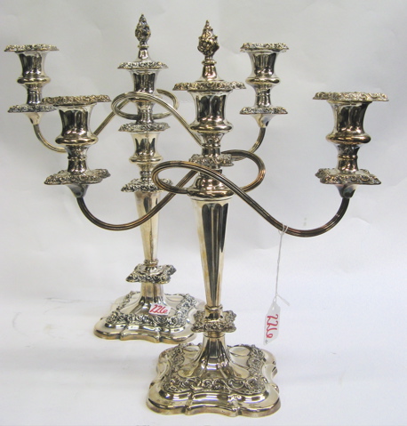 Appraisal: TWO SIMILAR ENGLISH ORNATE SILVER PLATED CANDELABRA c each convertible