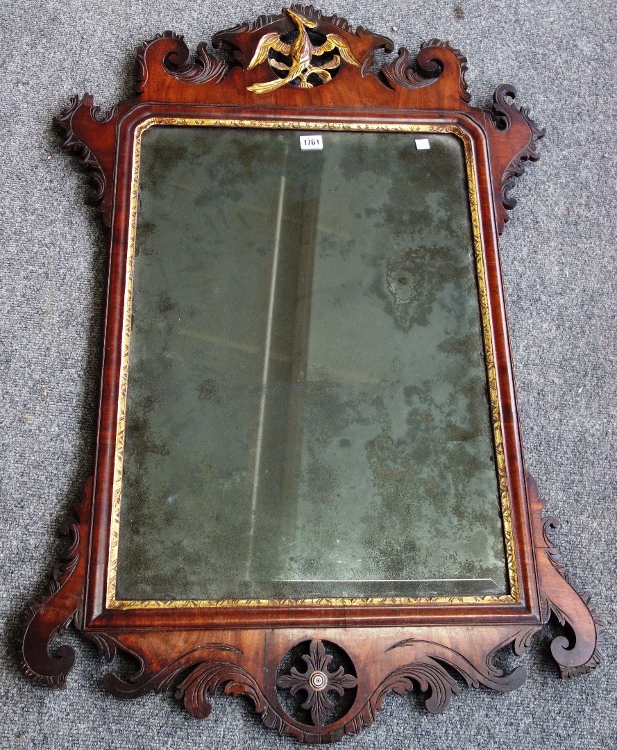 Appraisal: A large George III mahogany fret cut wall mirror with