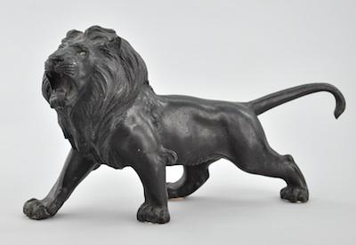 Appraisal: A Bronze Figurine of a Lion Cast bronze with dark