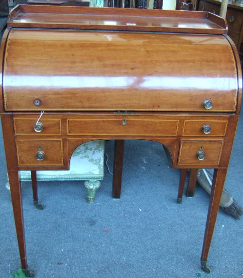 Appraisal: A George III mahogany and boxwood strung cylinder desk with