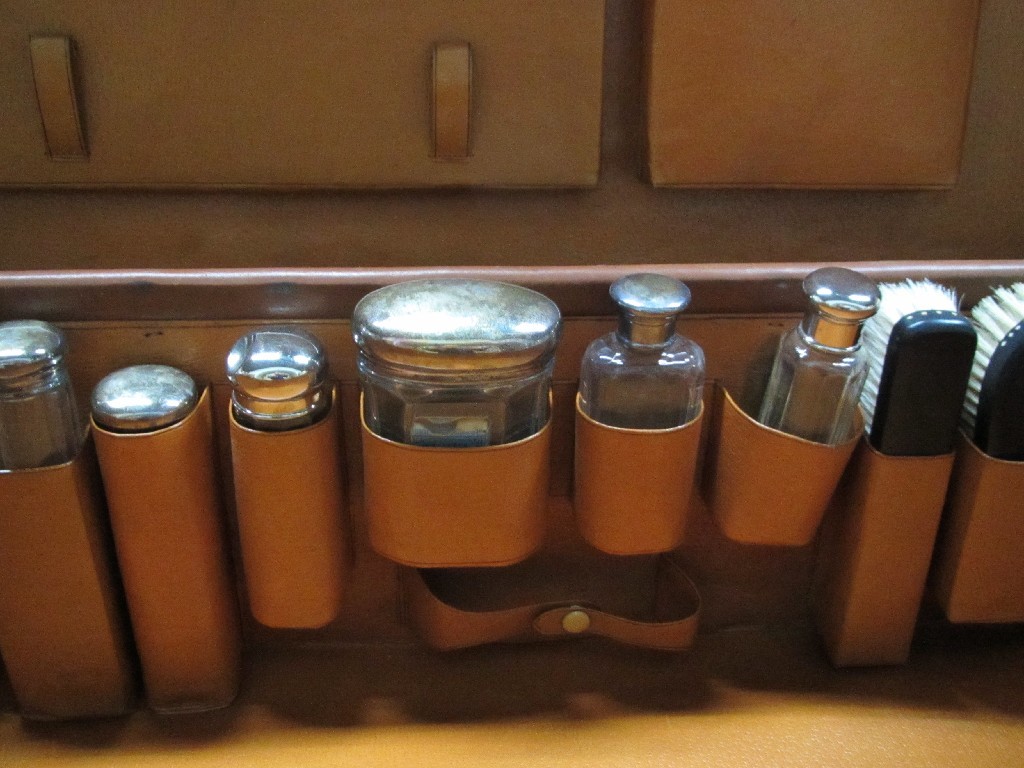 Appraisal: Fitted travel case with silver topped jars etc London