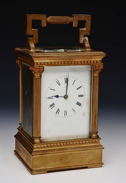 Appraisal: A FRENCH GILT METAL REPEATER CARRIAGE CLOCK with white enamel