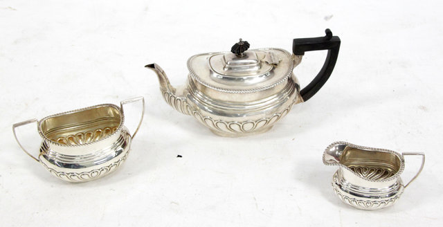 Appraisal: A three-piece silver tea set W A Birmingham with lobed