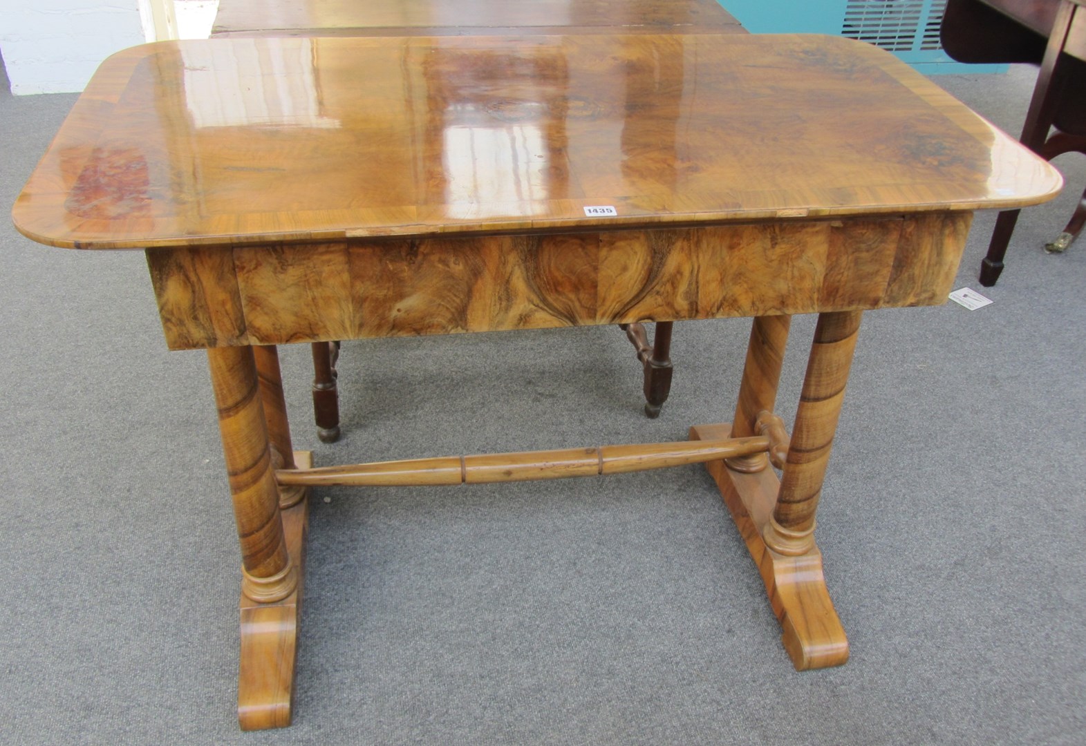 Appraisal: A Biedermeier figured walnut rectangular centre table with single frieze