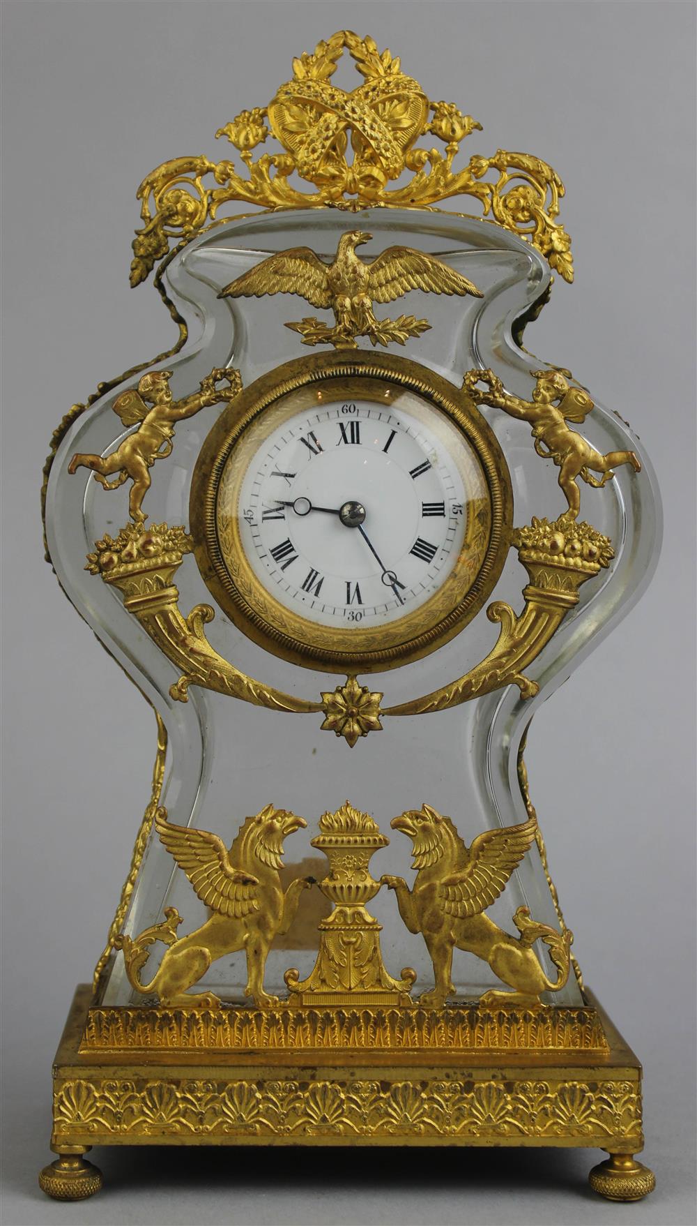 Appraisal: EMPIRE STYLE GILT BRONZE MOUNTED GLASS MANTEL CLOCK late th