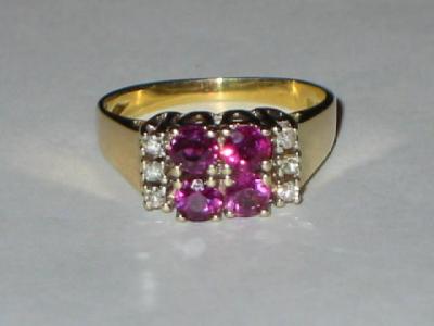 Appraisal: A RUBY AND DIAMOND CLUSTER RING comprising four round cut