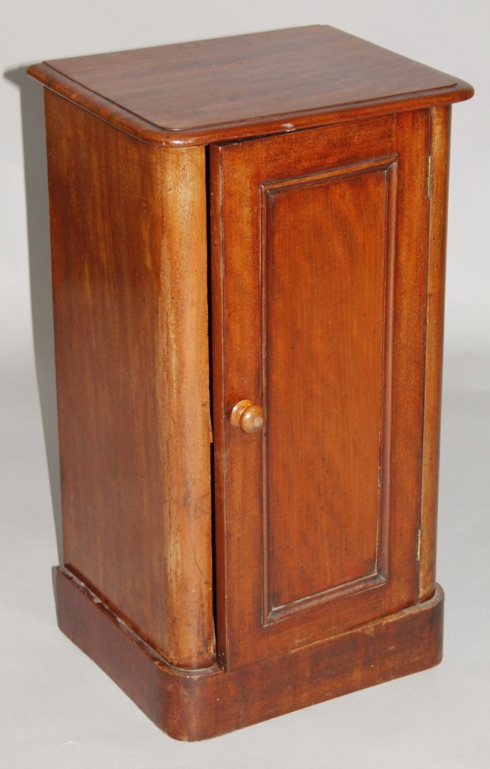 Appraisal: A Victorian mahogany pot cupboard the D-end top raised above