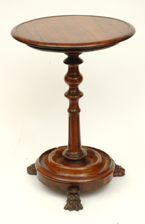 Appraisal: A VICTORIAN ROSEWOOD WINE TABLE Raised on three paw feet