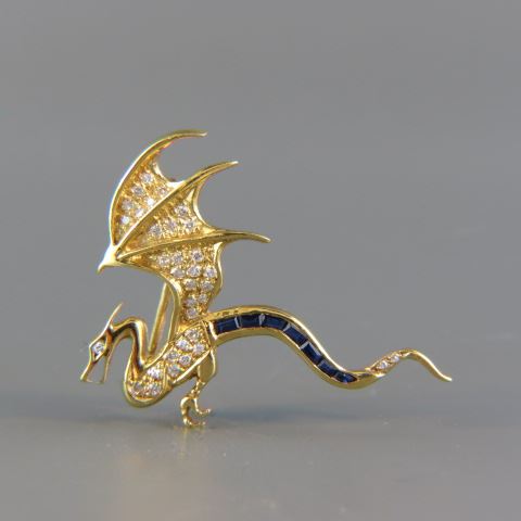 Appraisal: Sapphire Diamond Figural Dragon Brooch baguette blue sapphires and round