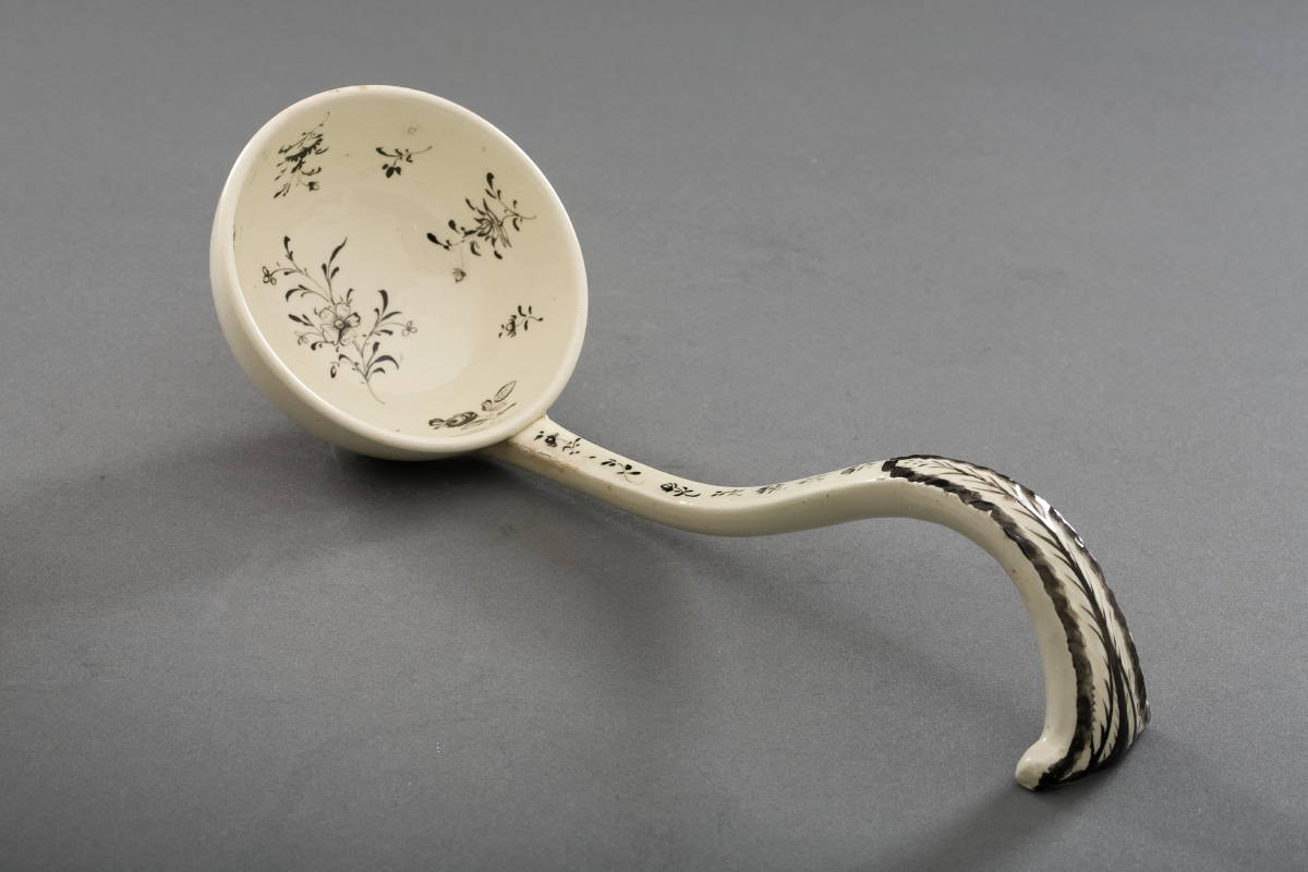 Appraisal: ENGLISH CREAMWARE ENAMEL-DECORATED AND BLACK TRANSFER-PRINTED BOWL COVER AND LADLE