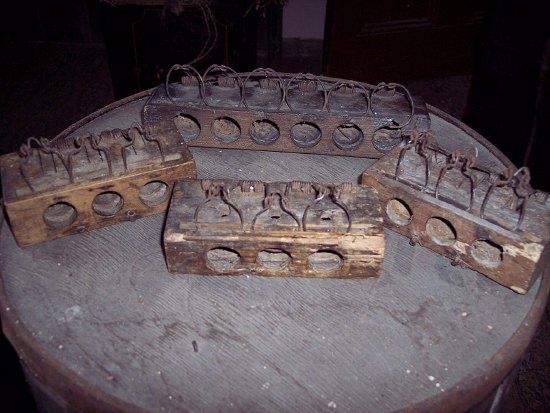 Appraisal: Four mouse traps each with multiple apertures in a wooden