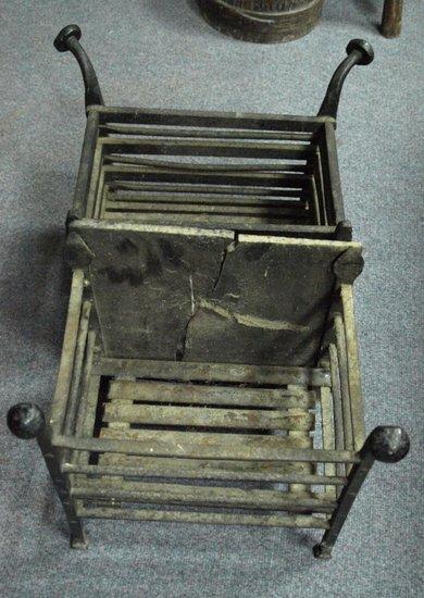 Appraisal: A th Century wrought iron fire basket and another similar