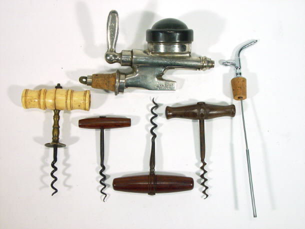 Appraisal: Ivory handled brass corkscrew and three other wooden handled corkscrews