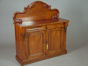 Appraisal: A Victorian mahogany chiffonier the raised serpentine acanthus carved back