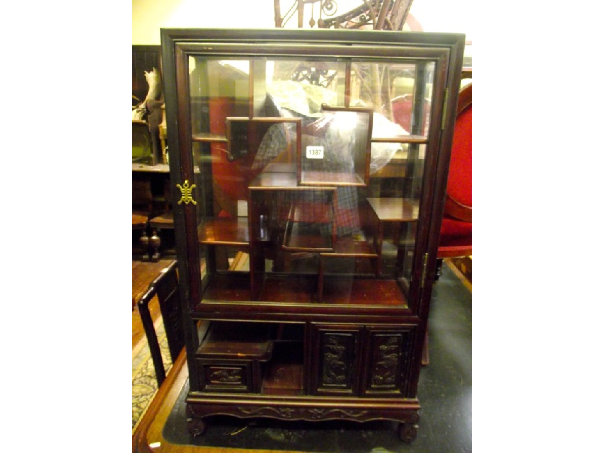 Appraisal: A th century Chinese display cabinet of small proportion the