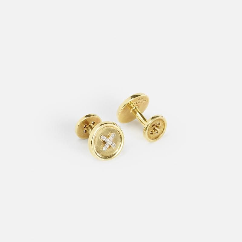 Appraisal: Tiffany Co A pair of gold and diamond Button cufflinks