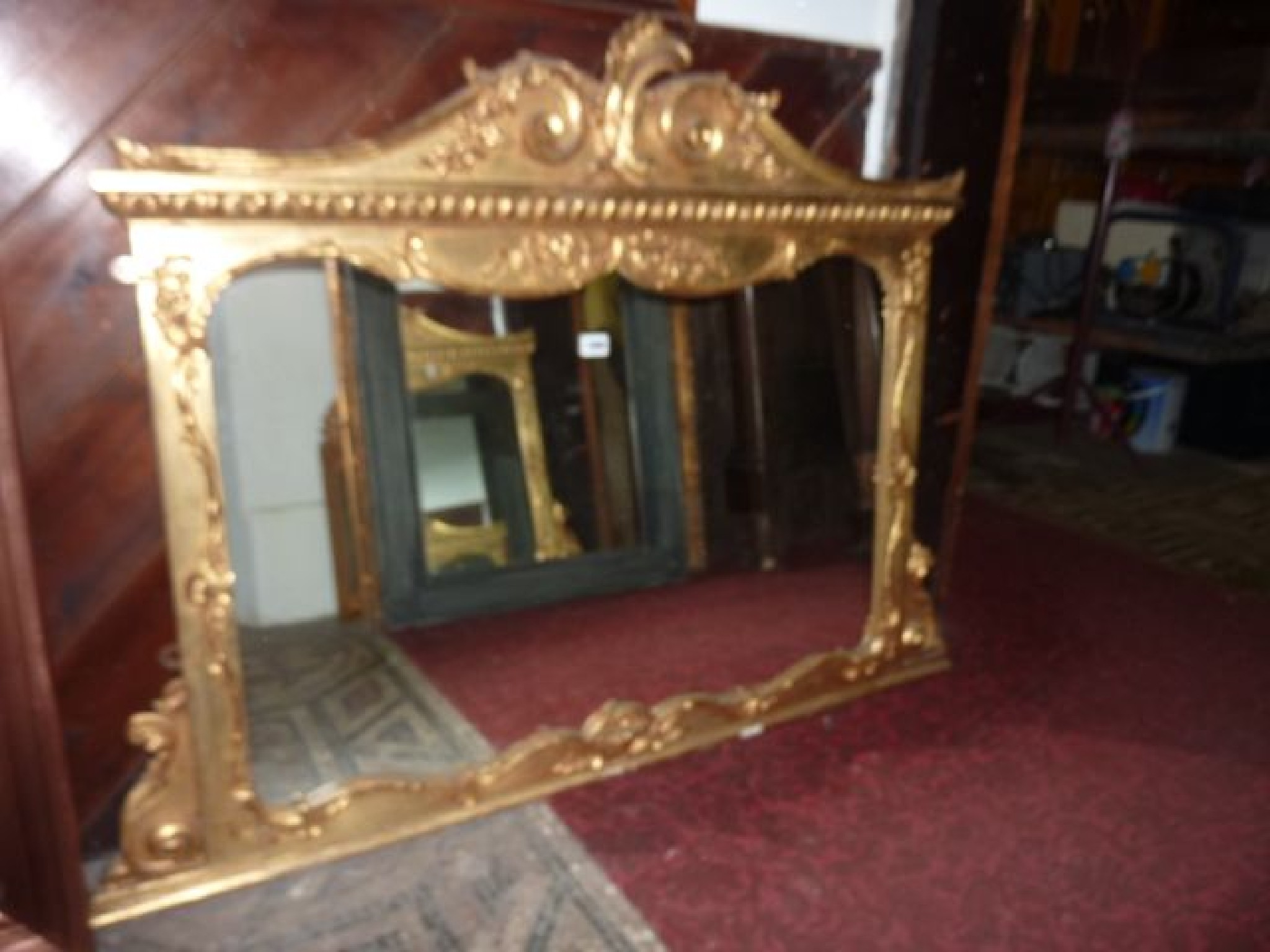 Appraisal: A gilt framed overmantle mirror of rectangular form with applied