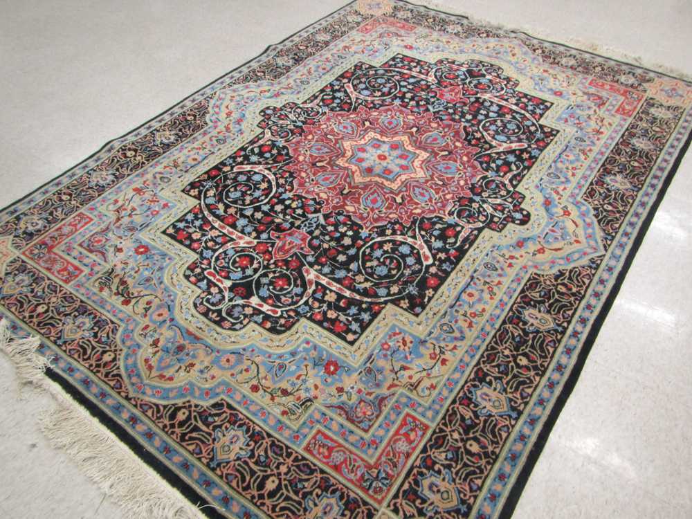 Appraisal: HAND KNOTTED ORIENTAL CARPET Sino-Persian floral and central floral medallion