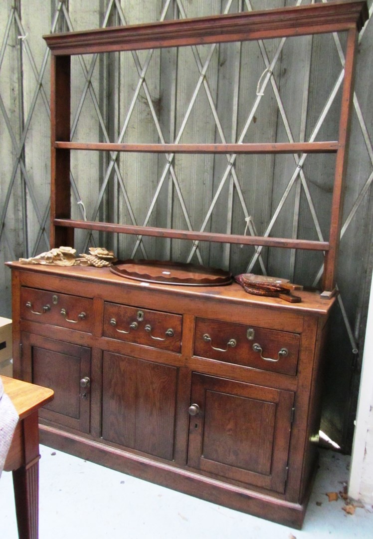 Appraisal: An th century oak dresser the open two tier plate