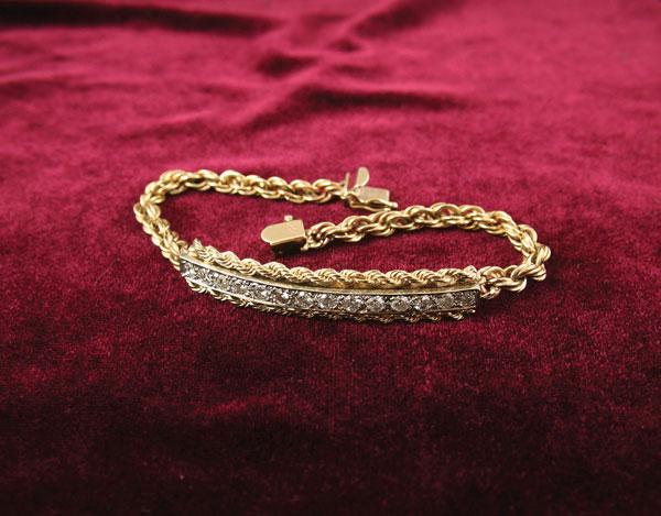 Appraisal: A k gold Bracelet with rope twist centred by panel