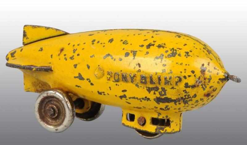 Appraisal: Cast Iron Kenton Pony Blimp Toy Description American Yellow Solid